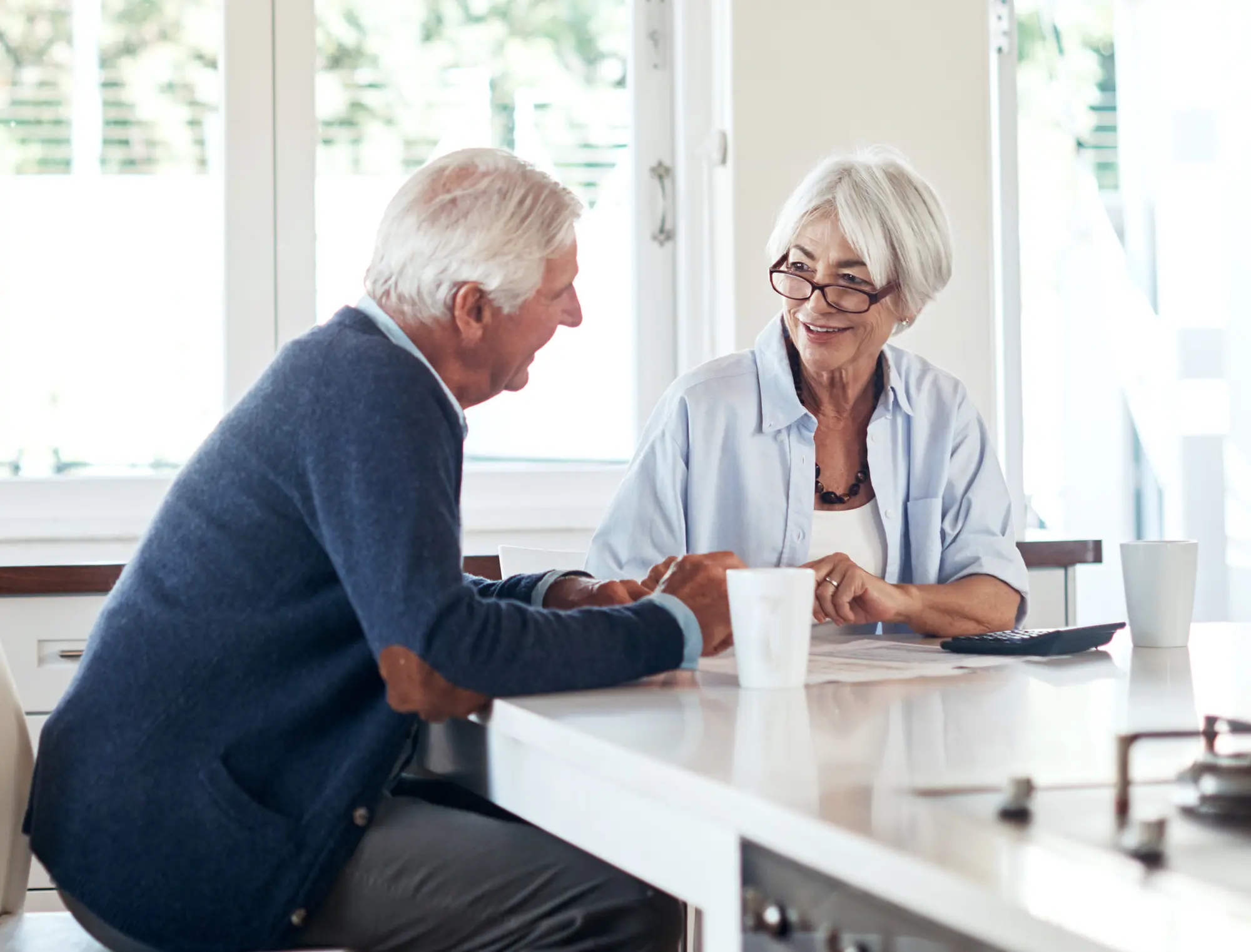 Man and woman talking about minimizing your taxes using gifting strategies