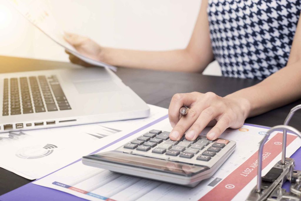 Woman calculates finances in retirement