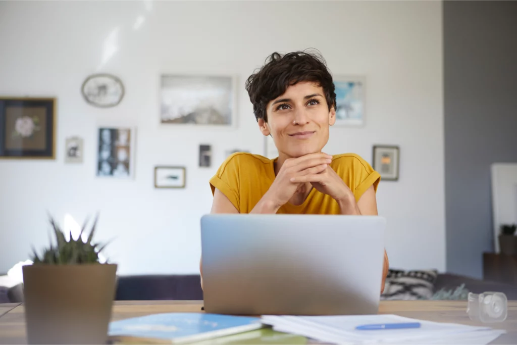 Woman sitting in front of laptop