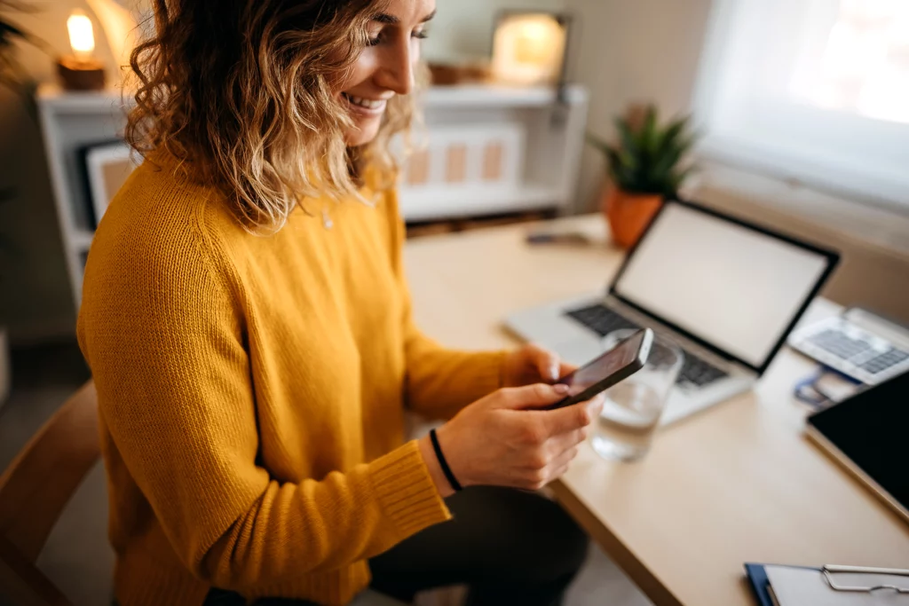 Young woman looking at phone.