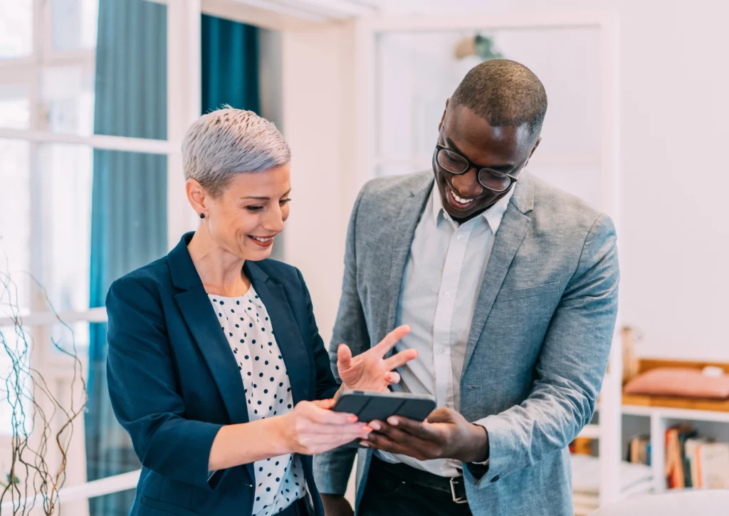 Woman and man looking at phone together