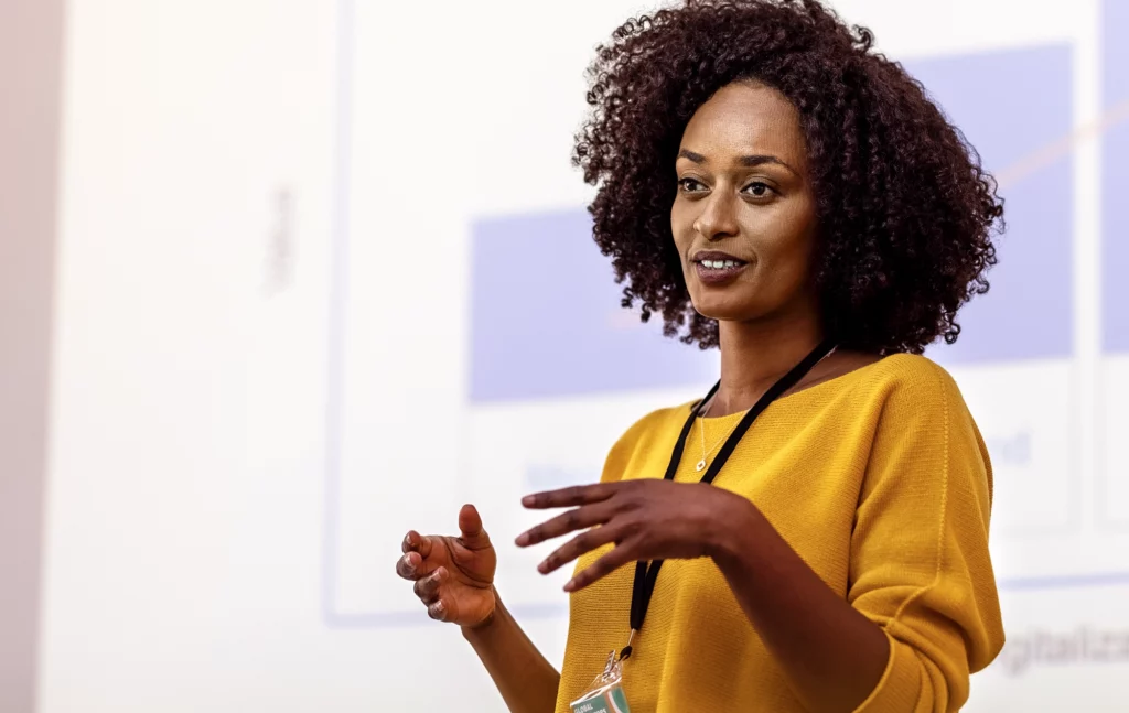 Woman presenting in front of screen