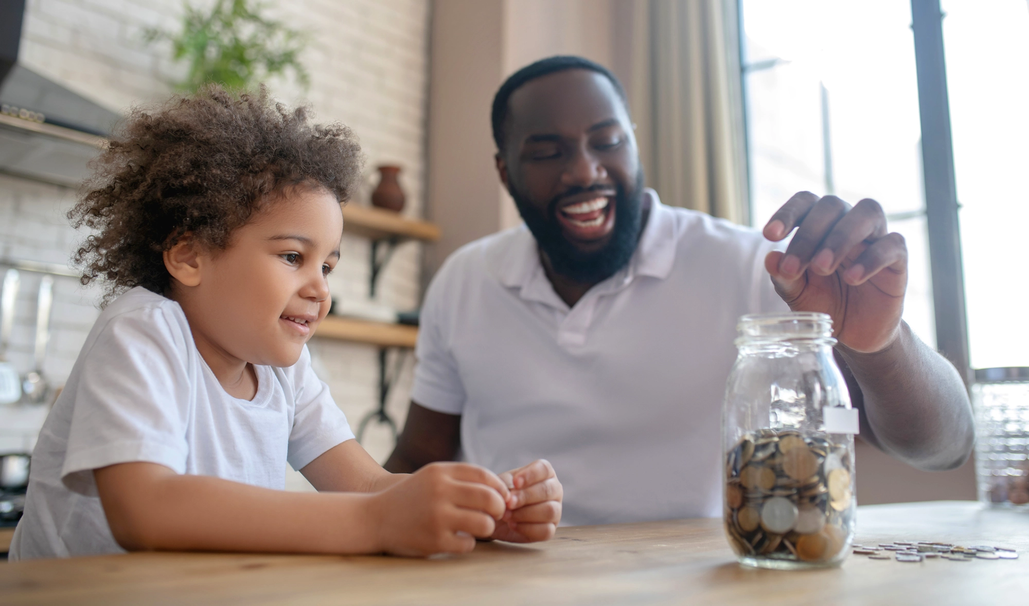 Grandfather with grandchild saving coins.