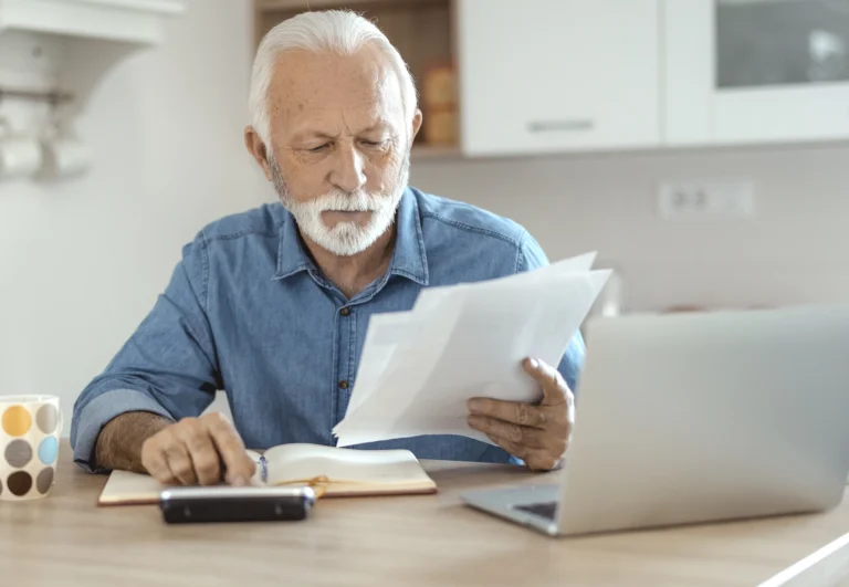 Senior man looking at paperwork