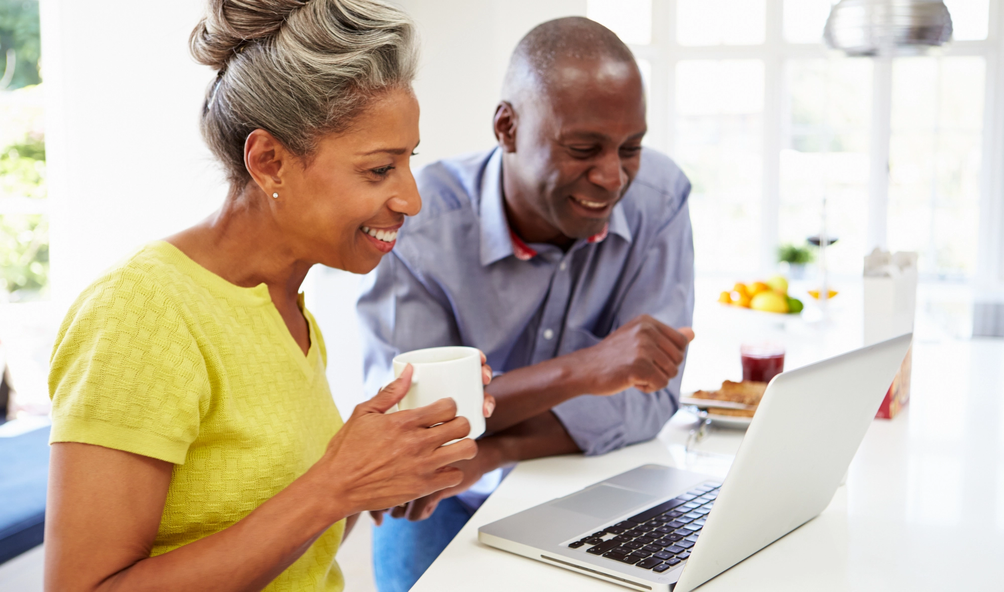 Senior couple looking at laptop