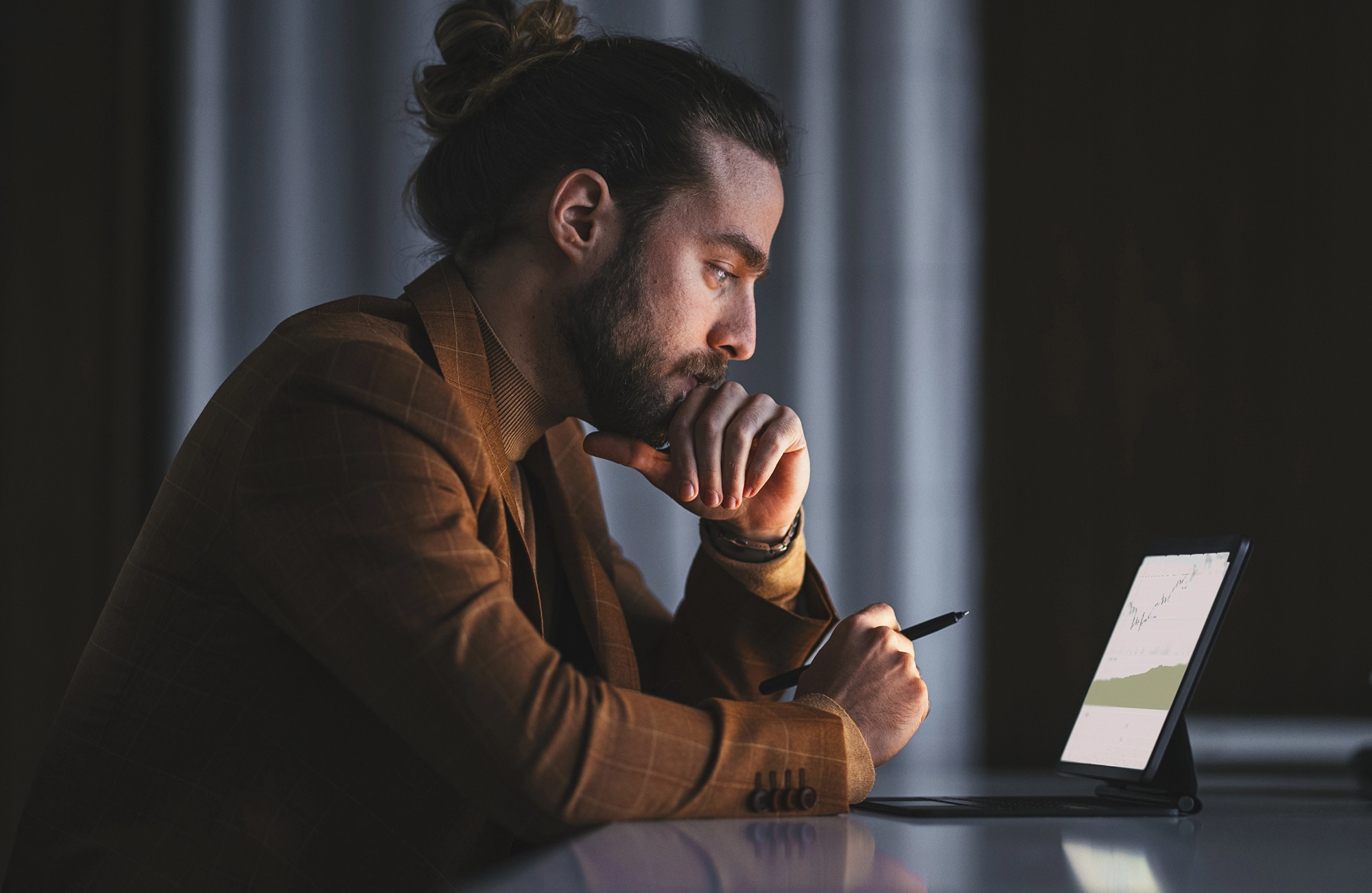 Young man looking at laptop