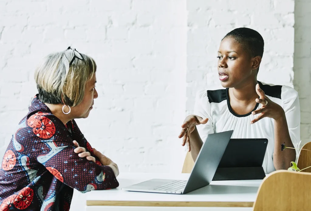 Two women at a desk