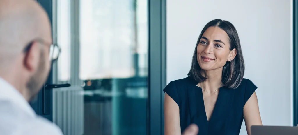man meeting with a financial advisor in conference room