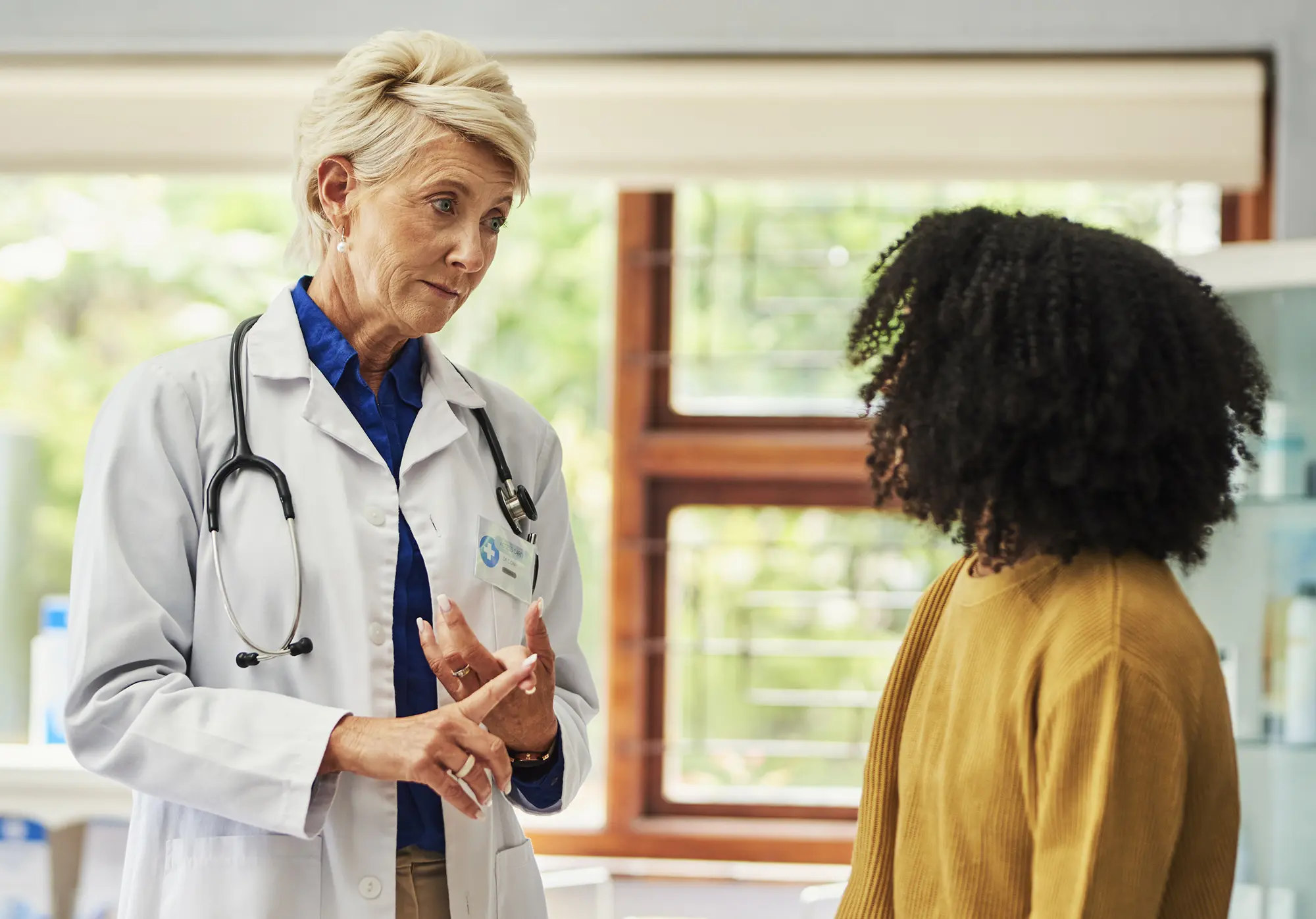 Doctor talking to young woman