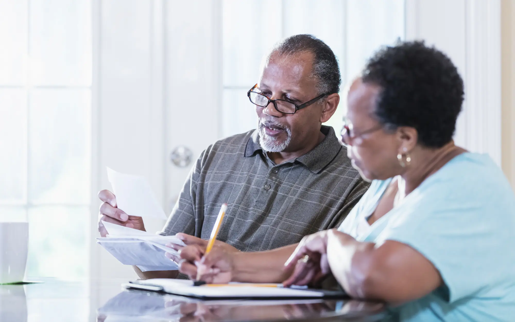 Senior couple looking at paperwork