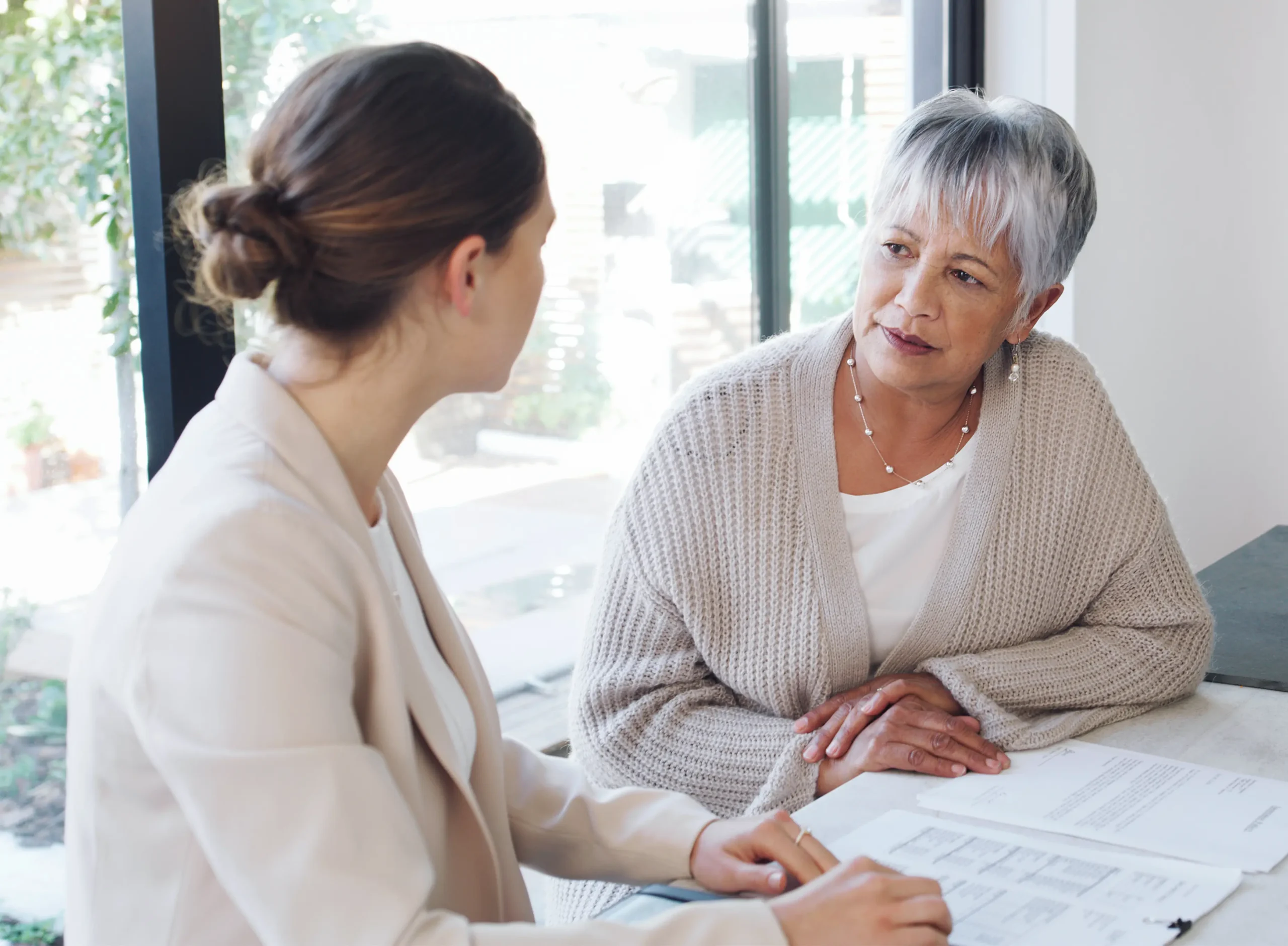 Senior woman consulting with a younger woman