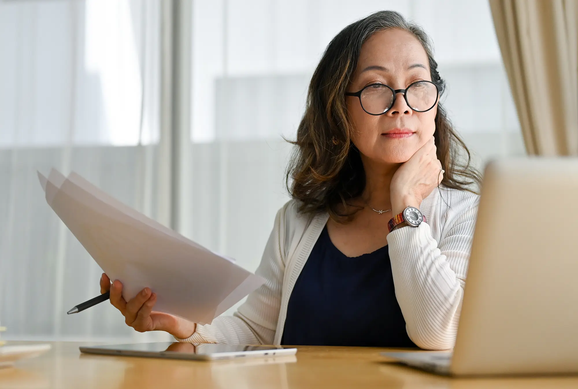 senior woman looking at laptop