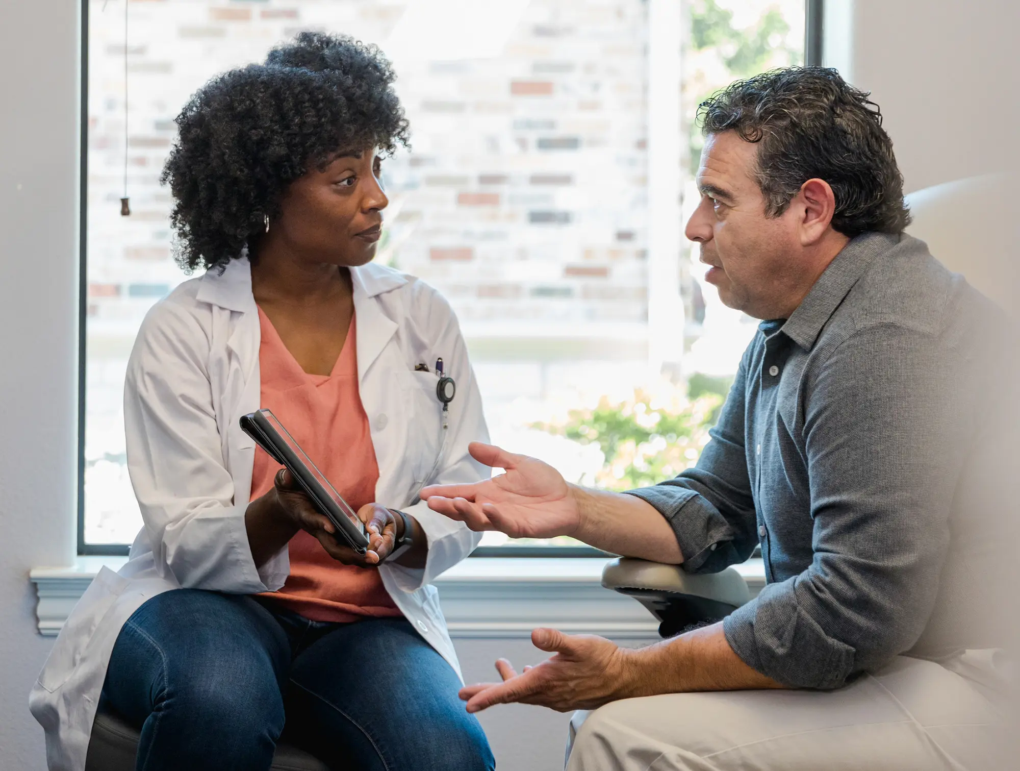 Man speaking with his doctor.