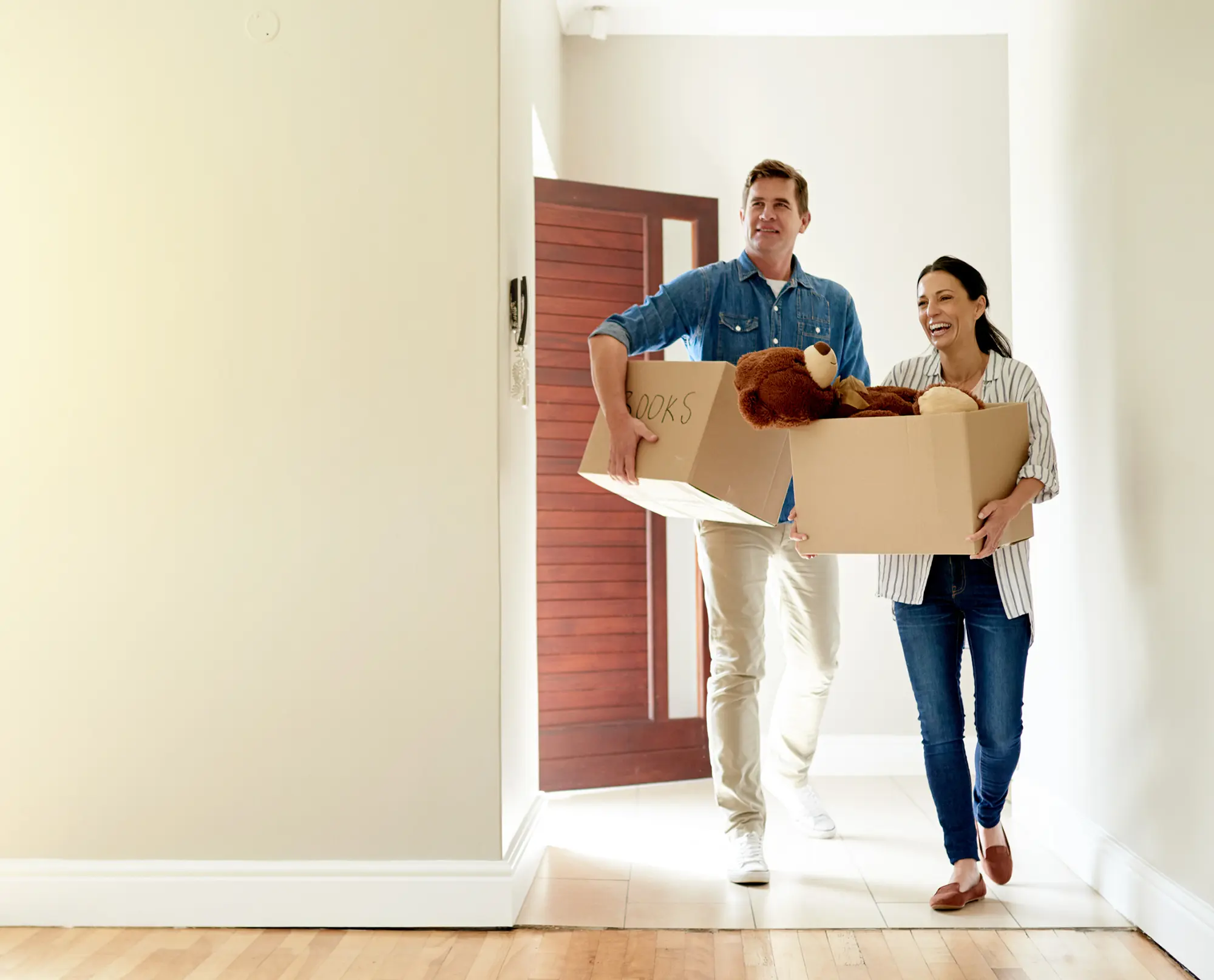 A young couple moving into a house.