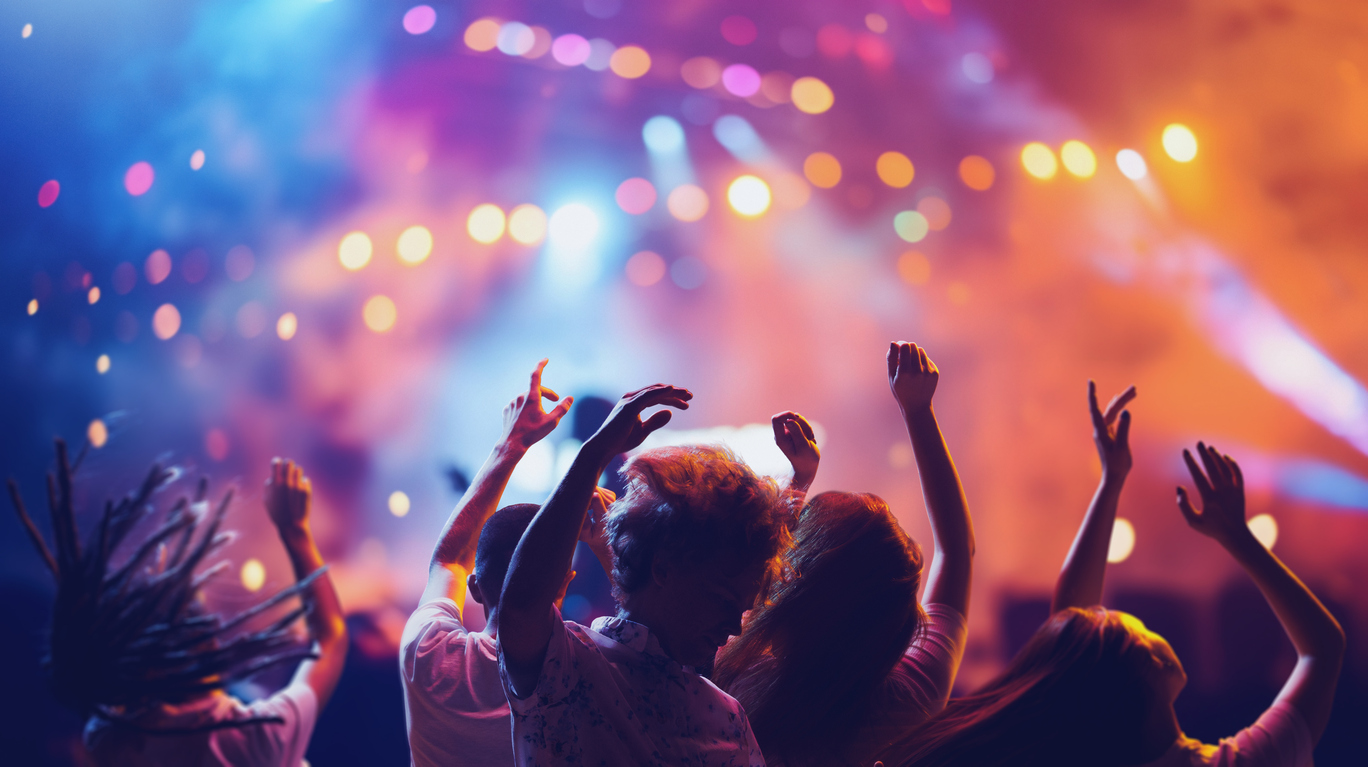 Fans dancing, jumping and singing during concert