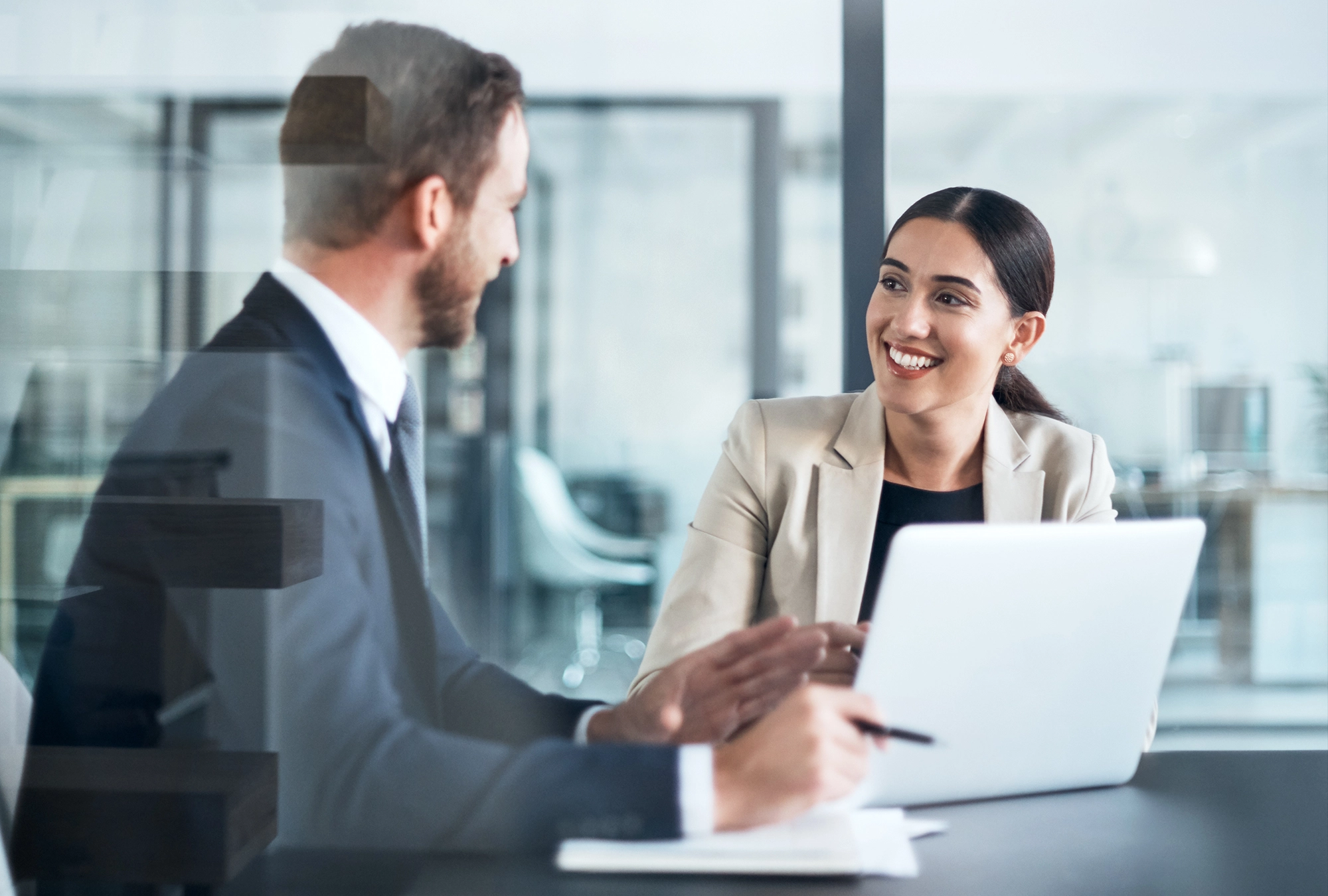 Financial advisor and client discussing options in conference room