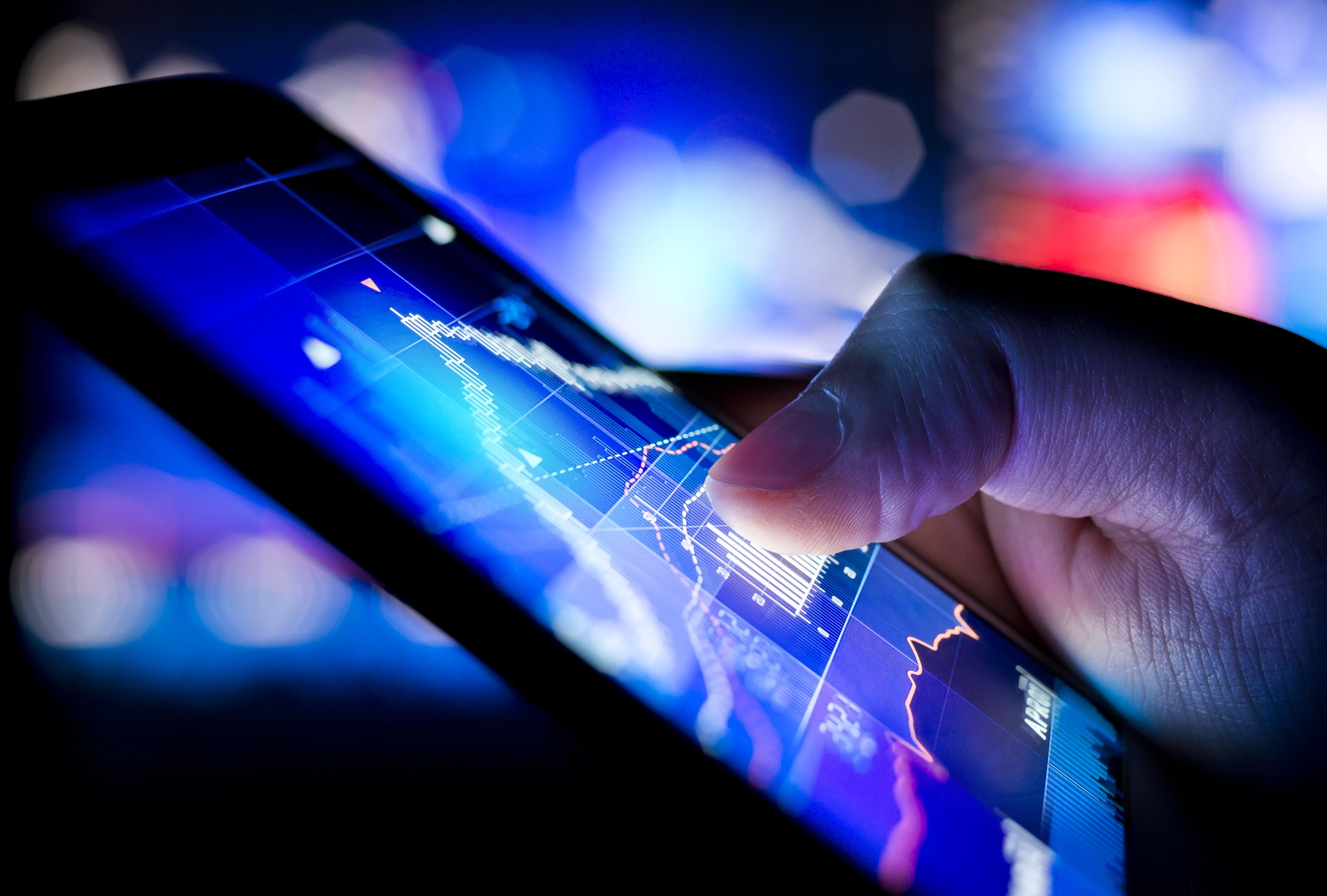 closeup shot of tablet showing stock prices over time