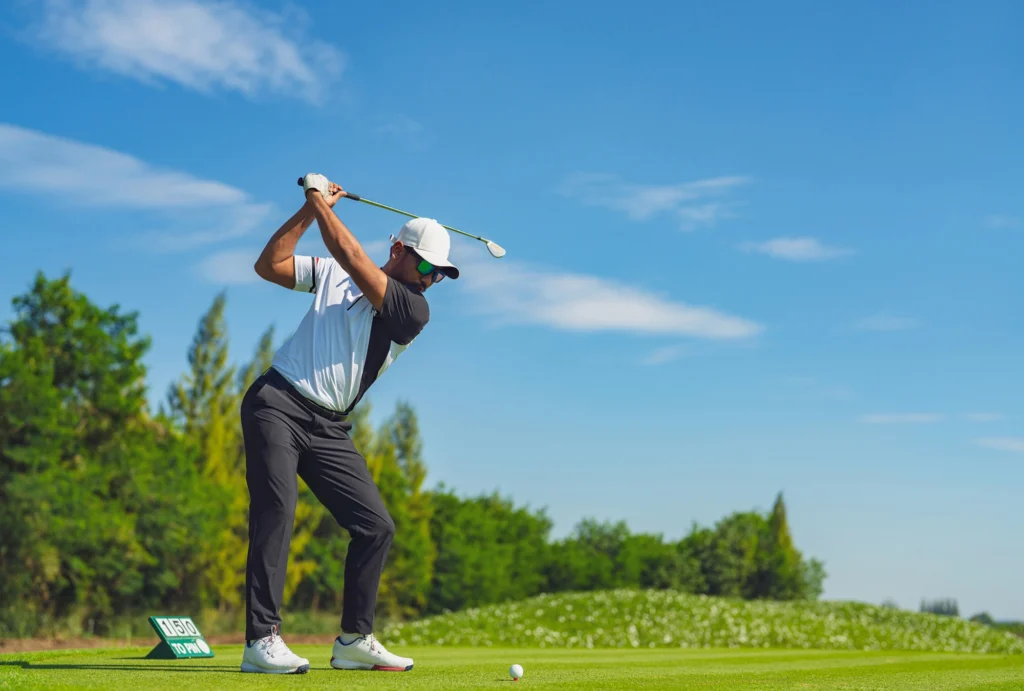 A golfer hitting a great shot