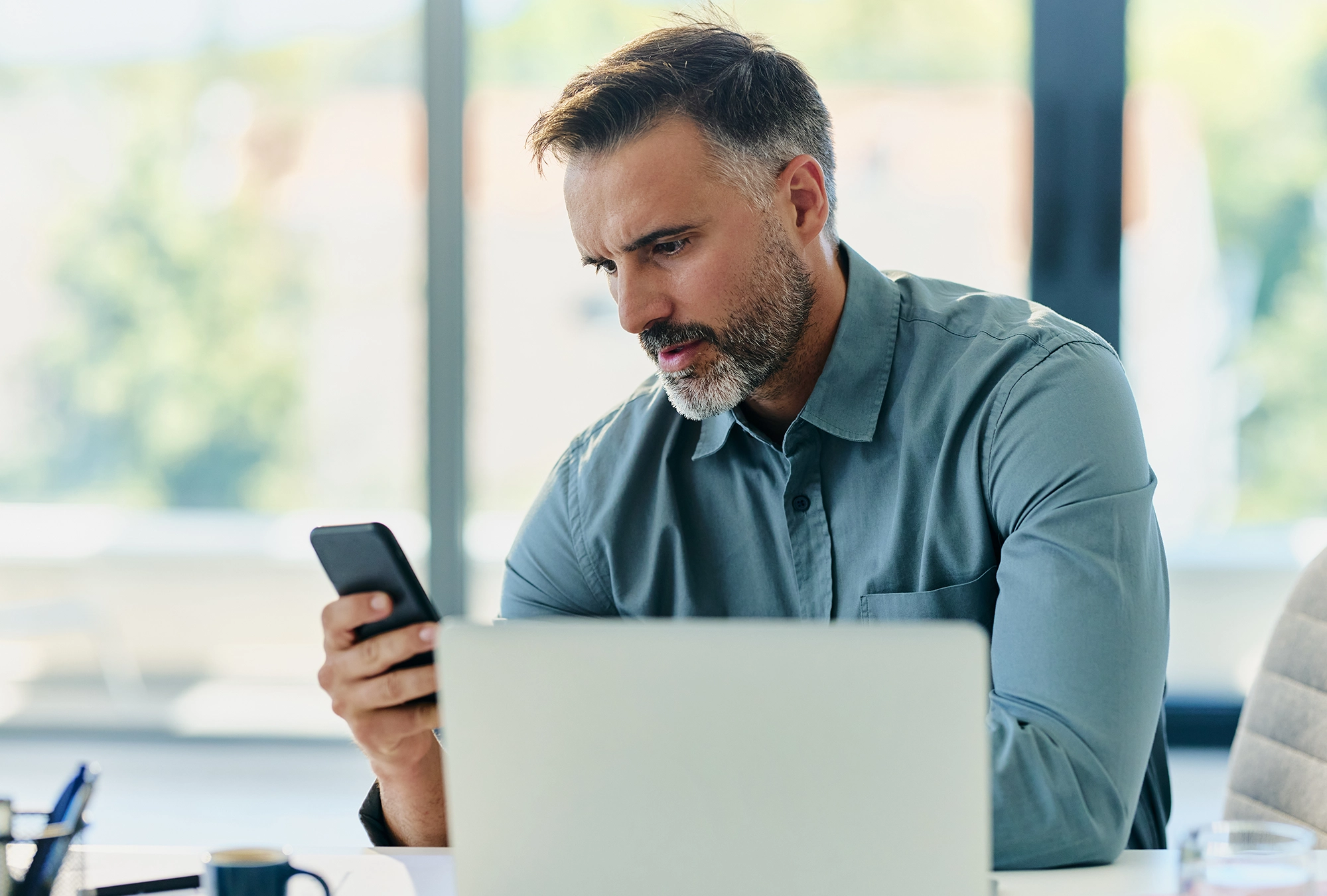 A man learning more about AI scams