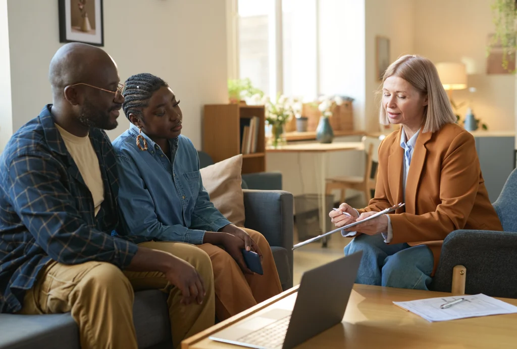 A couple talking with their advisor about HSA funds