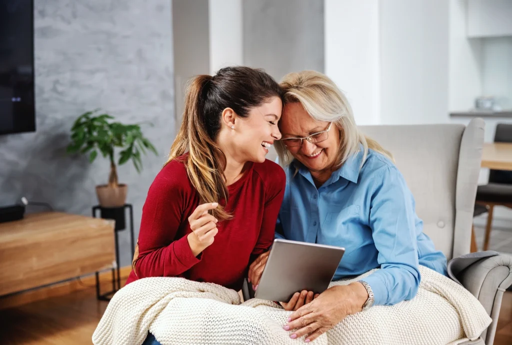 A mother and daughter exchanging gifts