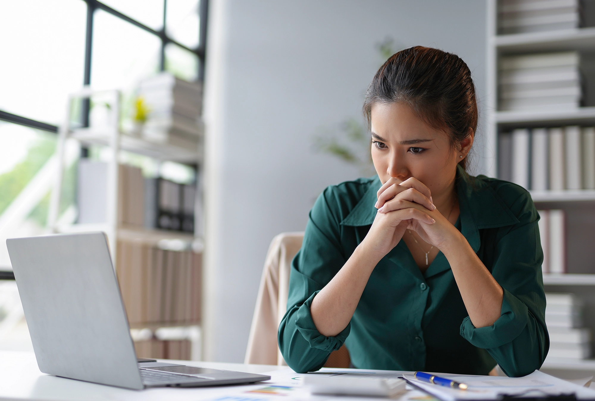 A lady looking at her financials after following social media
