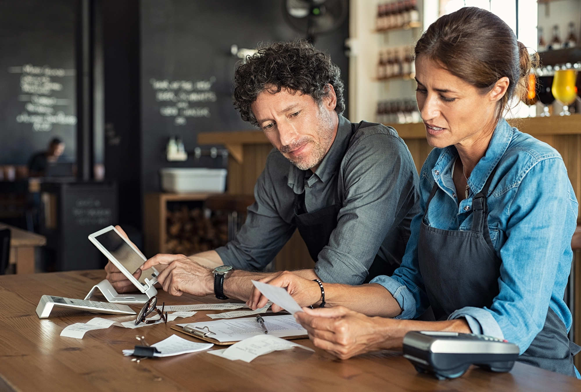 Two people preparing for the sunset of enhanced premium tax credits