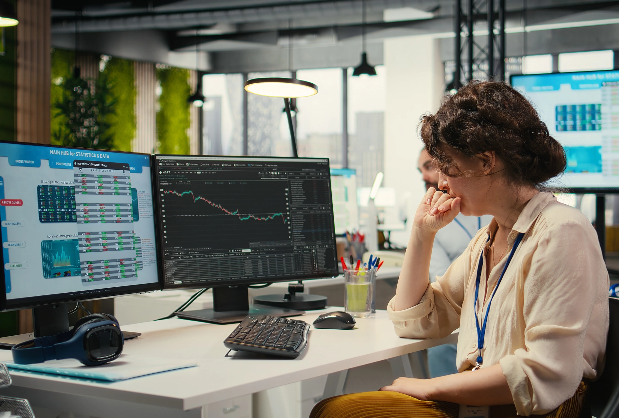 A person looking at charts and graphs on their computer