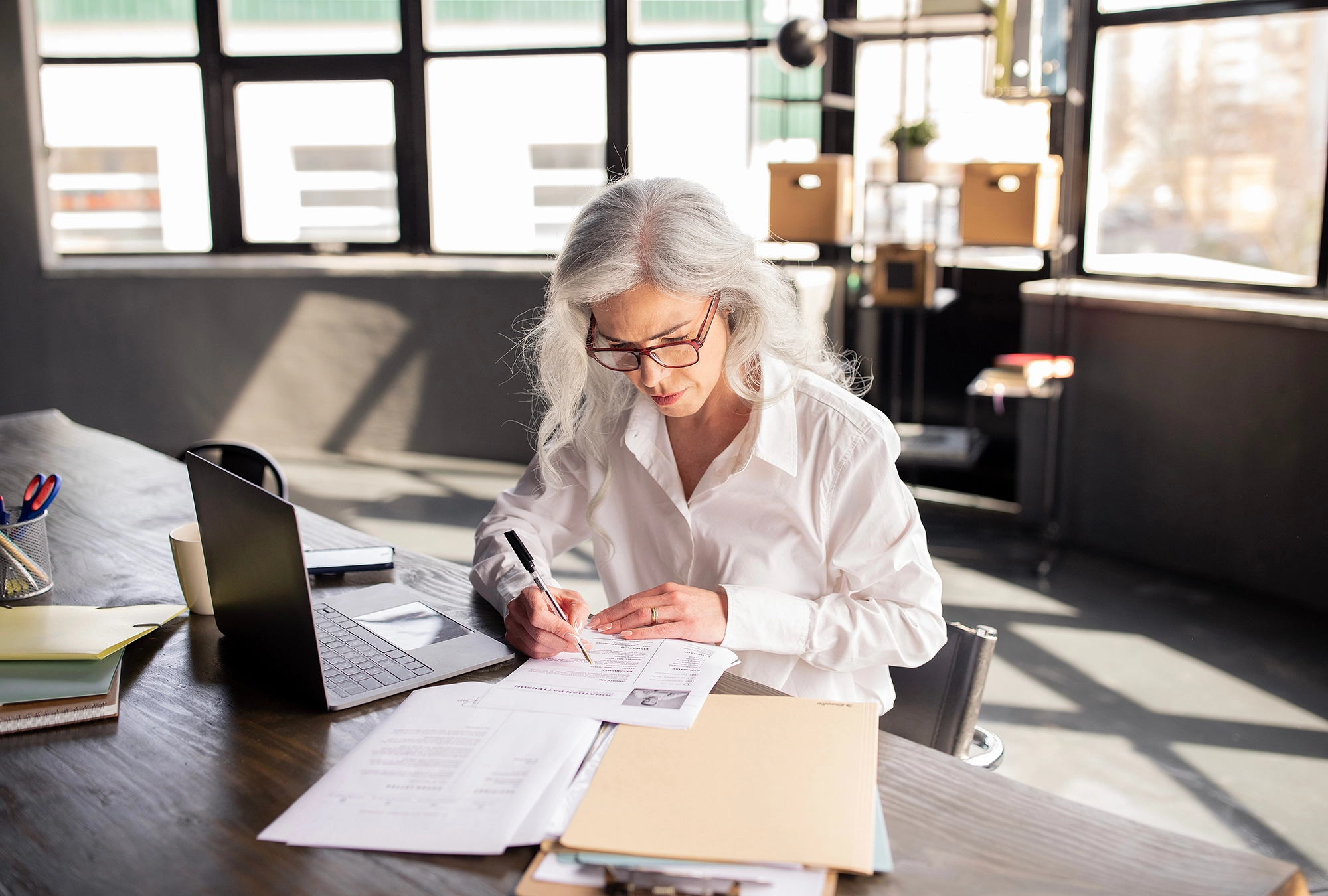 A pay role specialist reviewing social security