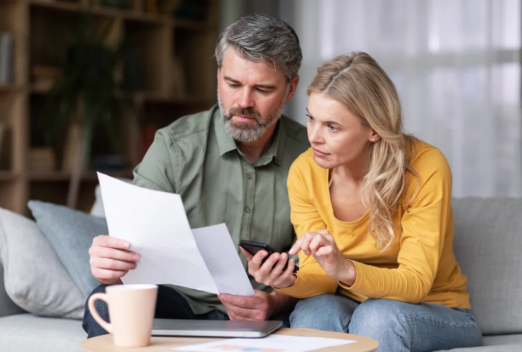 A couple planning their financial giving for the year